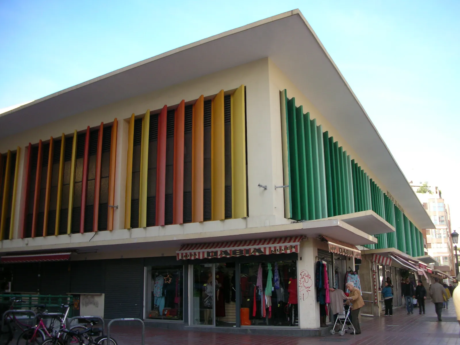 Exterior of the Mercat de Russafa, a modern market building with a coloured slatted facade.