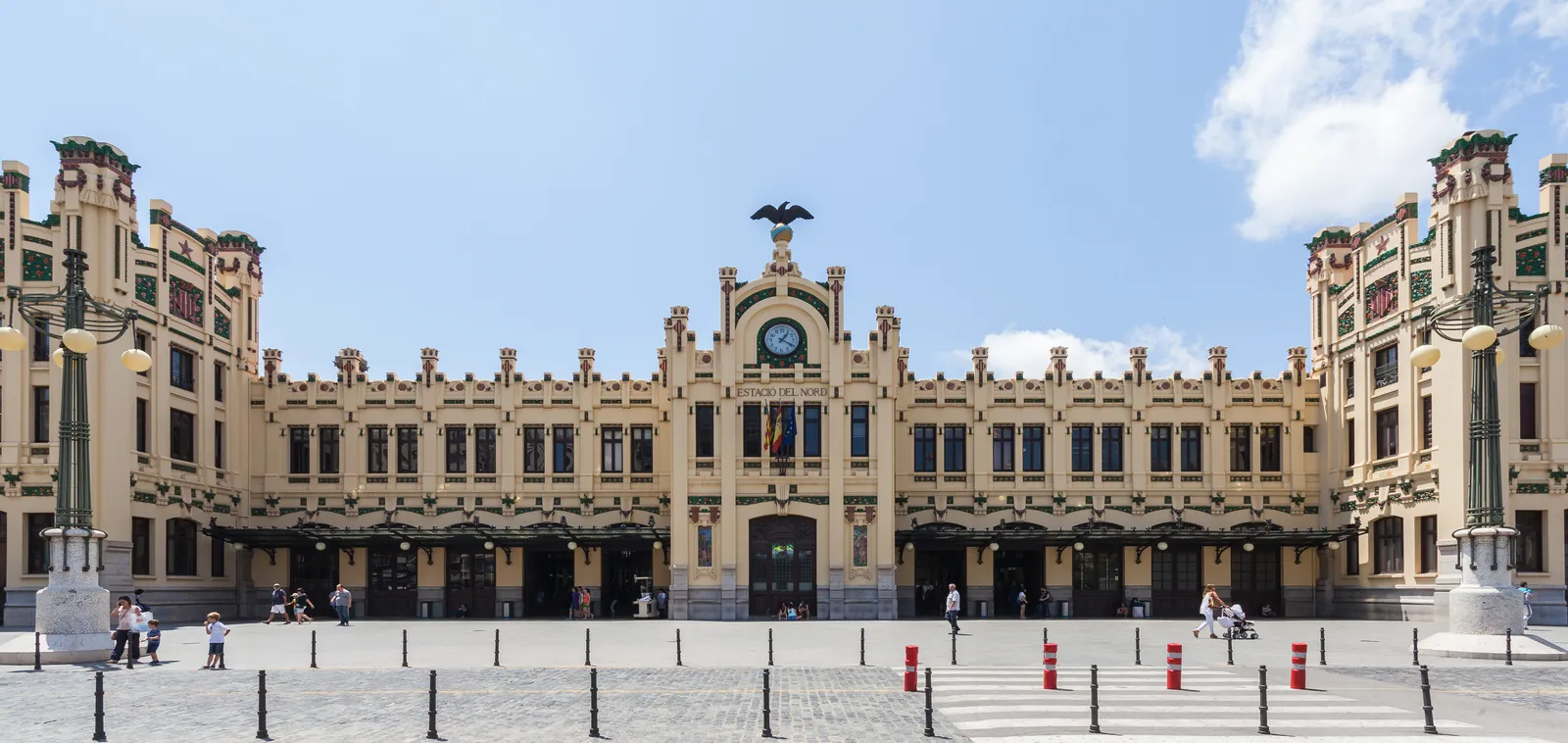 Front facade of the Estacio del Nord railway station with its tiled decoration and clock