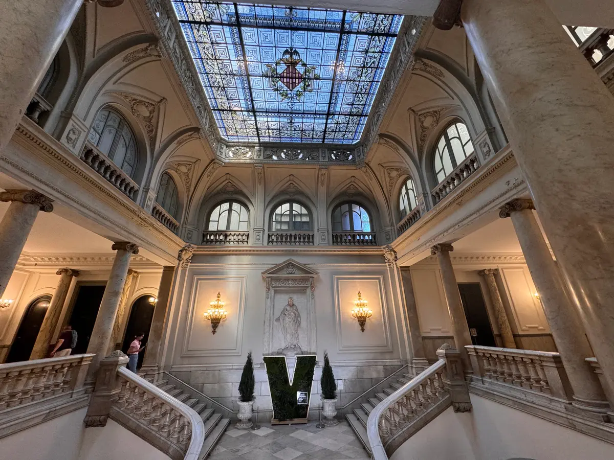 Marble staircase and stained-glass ceiling inside Valencia City Hall