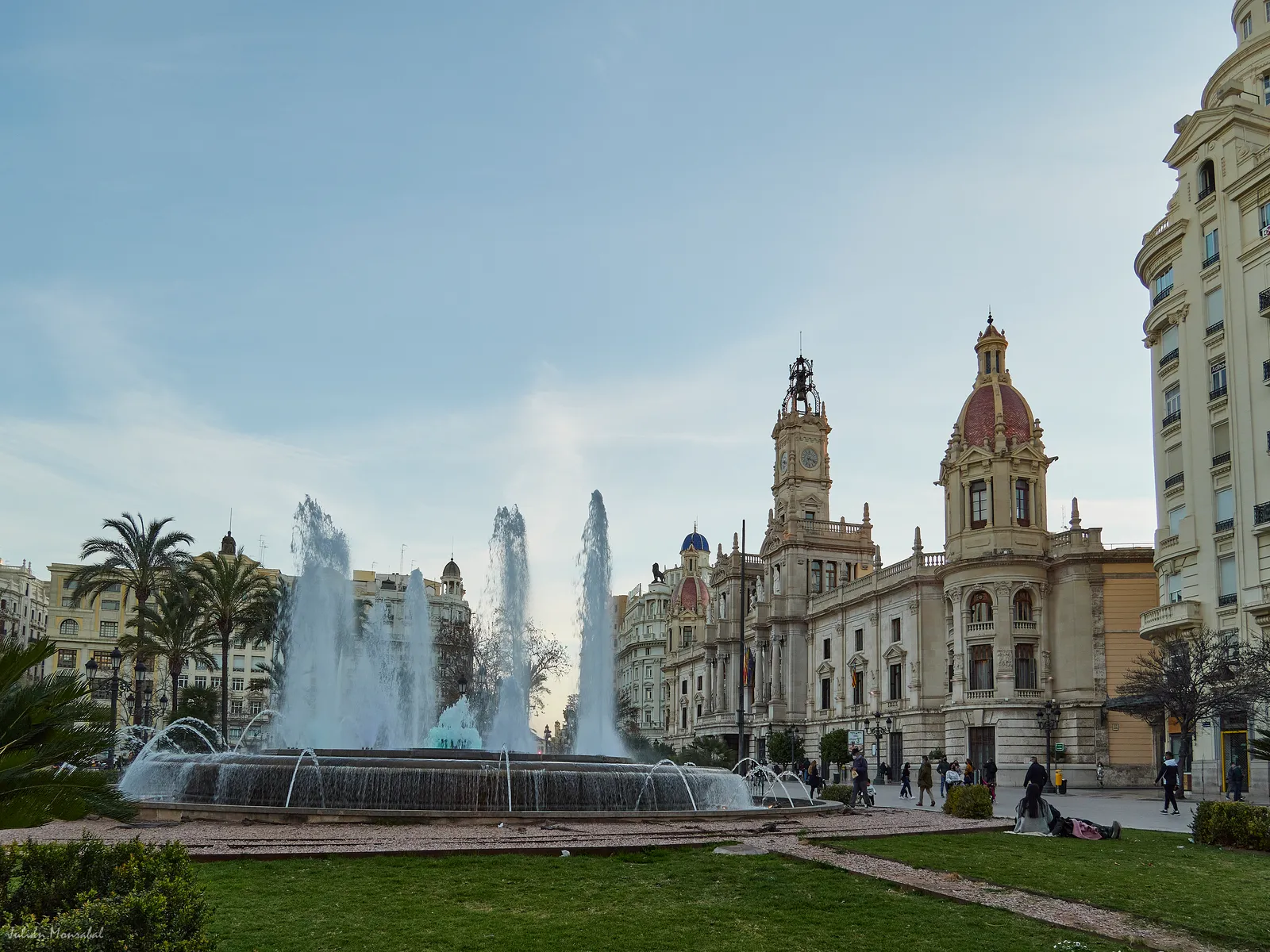 Fountain and the town hall building on a city square in Valencia