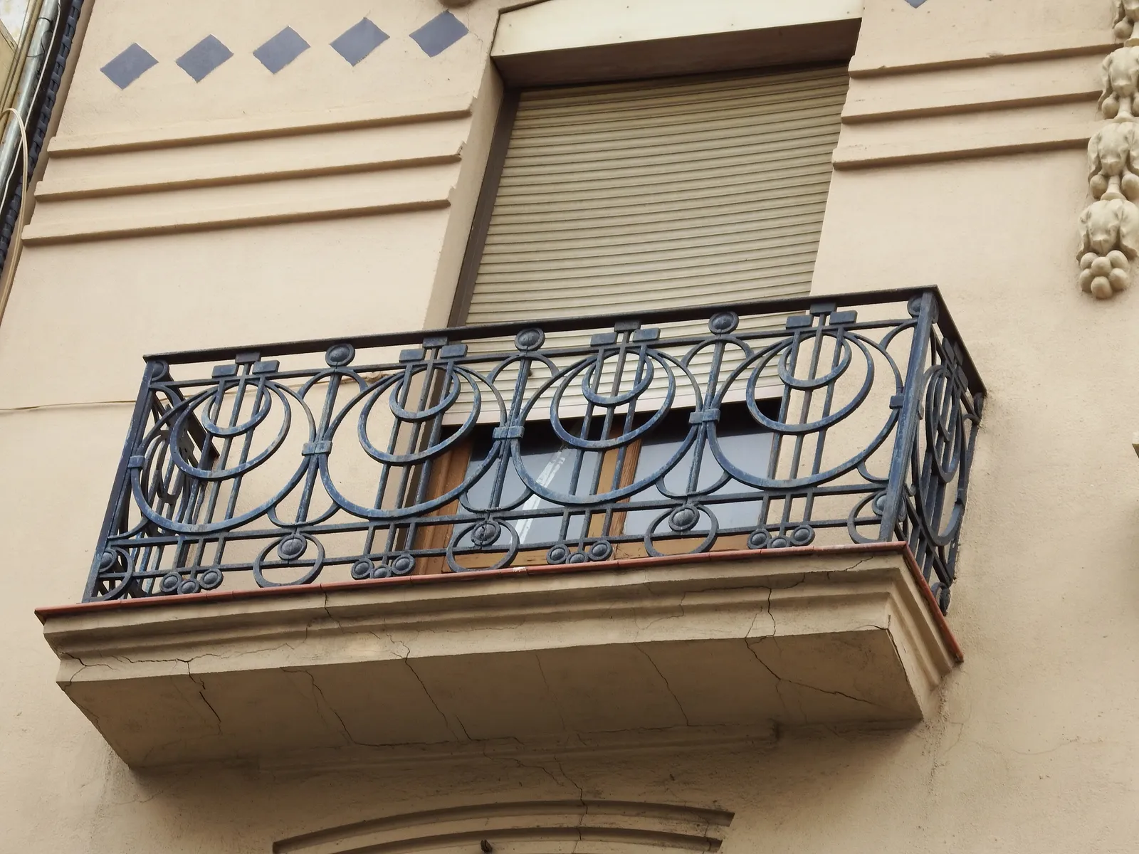 Wrought-iron balcony on a historic apartment building on Calle Ruzafa.