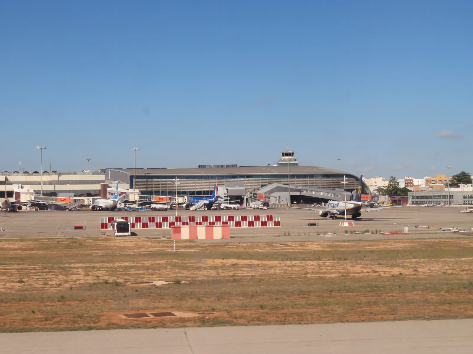 Valencia airport terminal and control tower seen across the apron