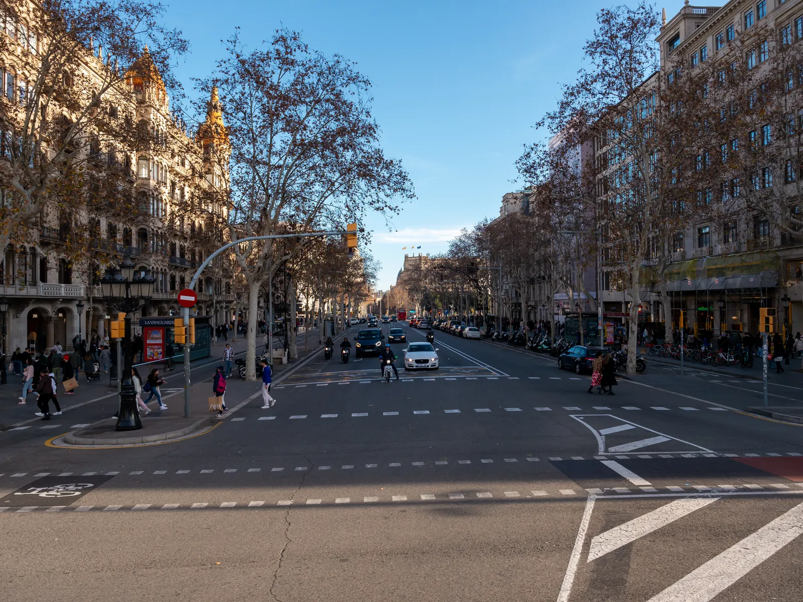 A street in the Eixample district of Barcelona with apartment blocks and balconies